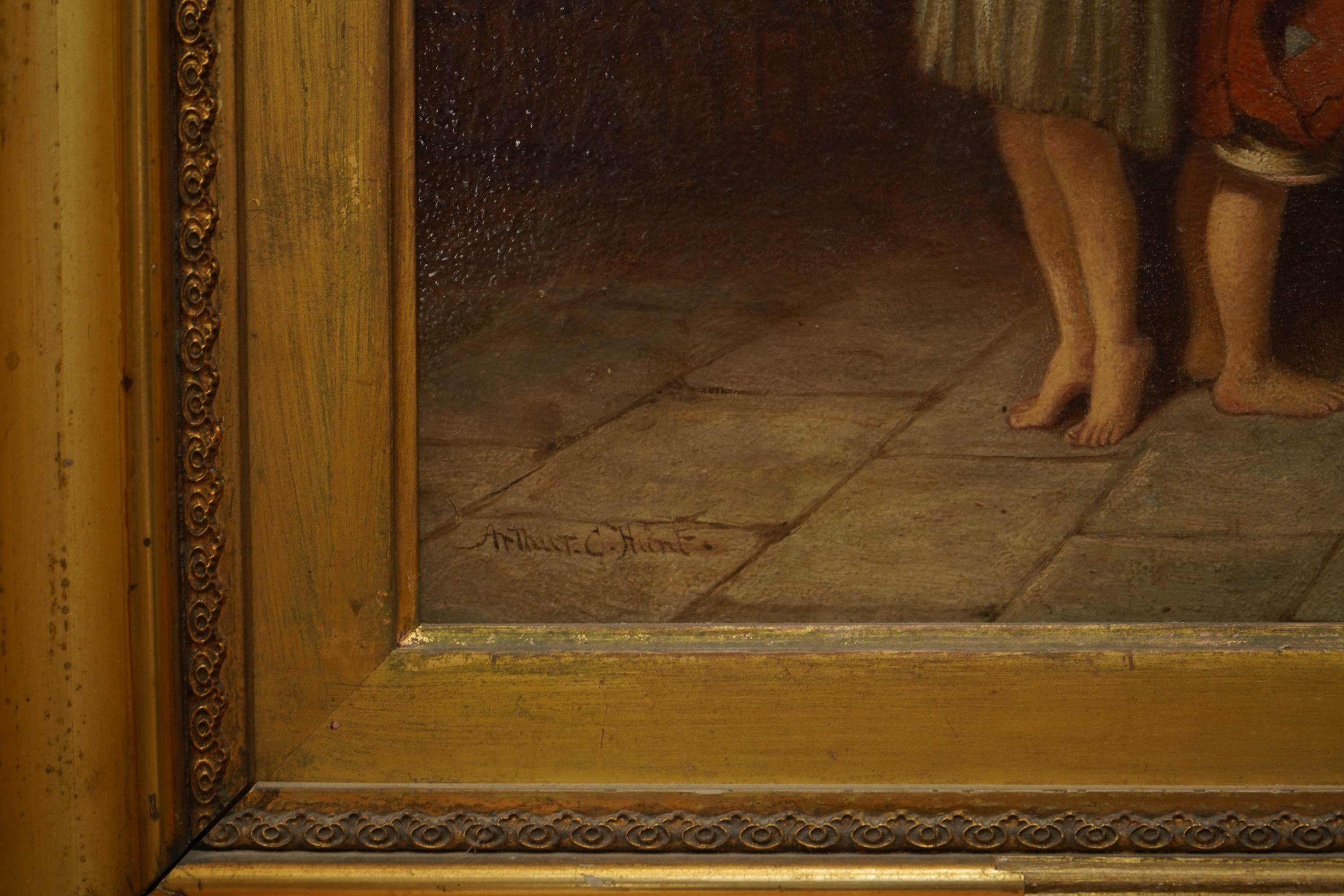 Arthur C Hunt (fl.1863-1902), Children measuring their height, signed, oil on panel, 36 x 27cm, gilt framed